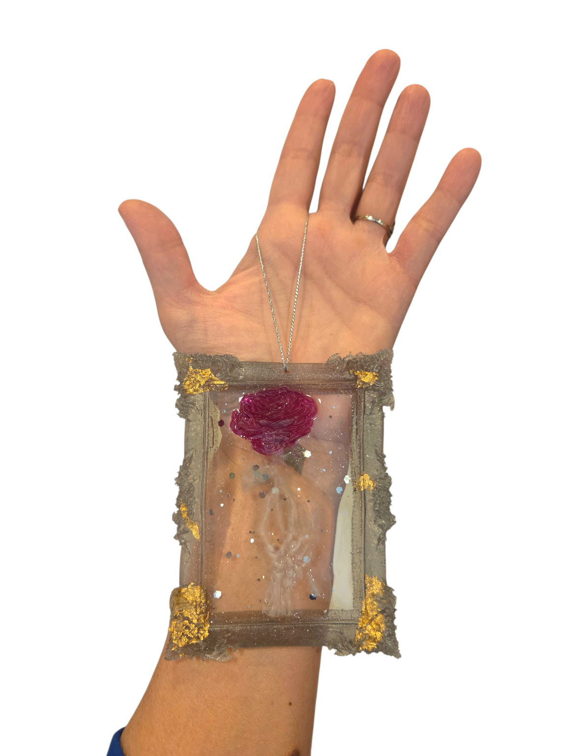 Large skeleton hand holding a rose (ornament)